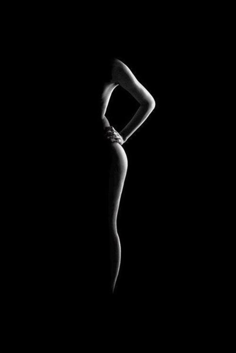 Female silhouette in the dark