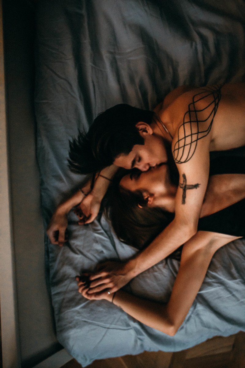 Guy and girl in bed