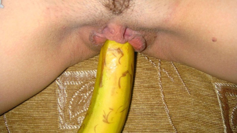 Girl shoves banana in pussy