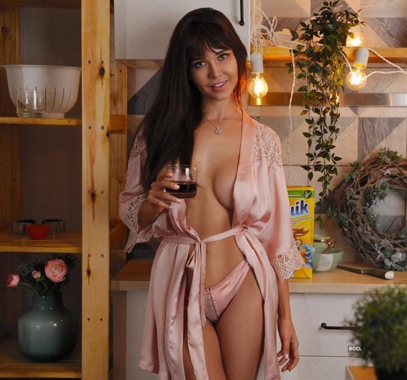 Naked beauty in a robe