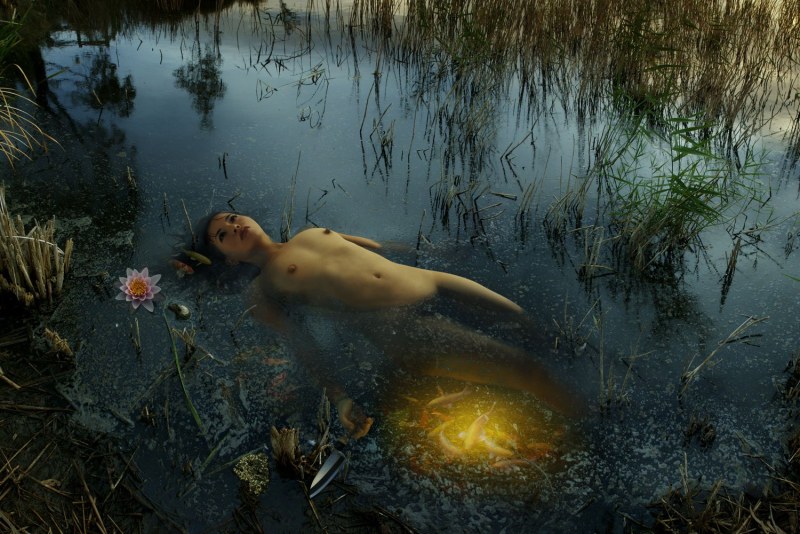 Naked bathes in a swamp