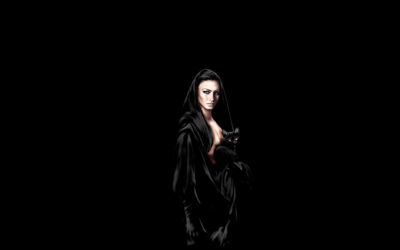 Girl in black on a black background