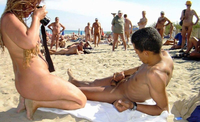 Guys and girls on a nudist beach