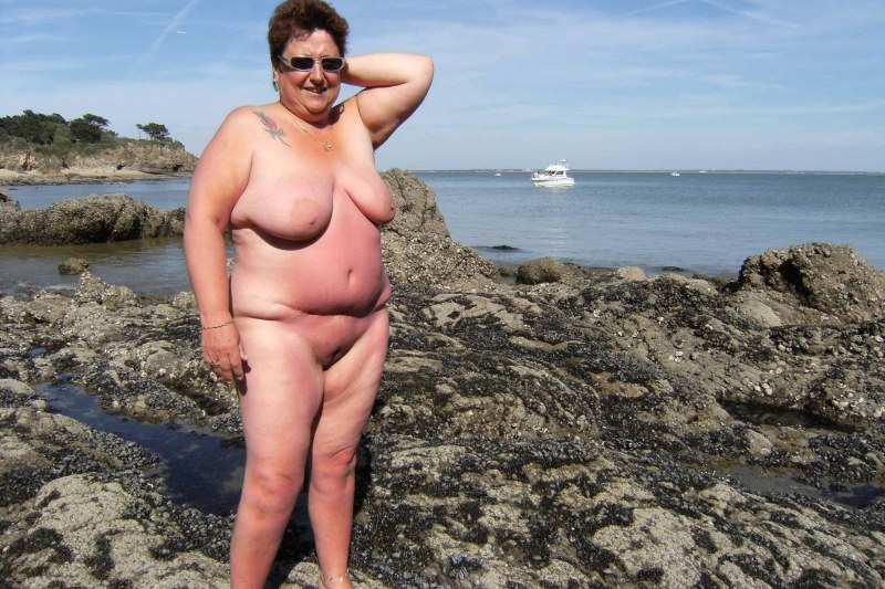 Old thick women on the beach