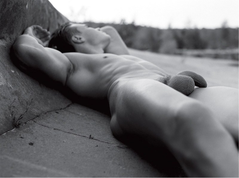 The photographer takes pictures of a bare guy