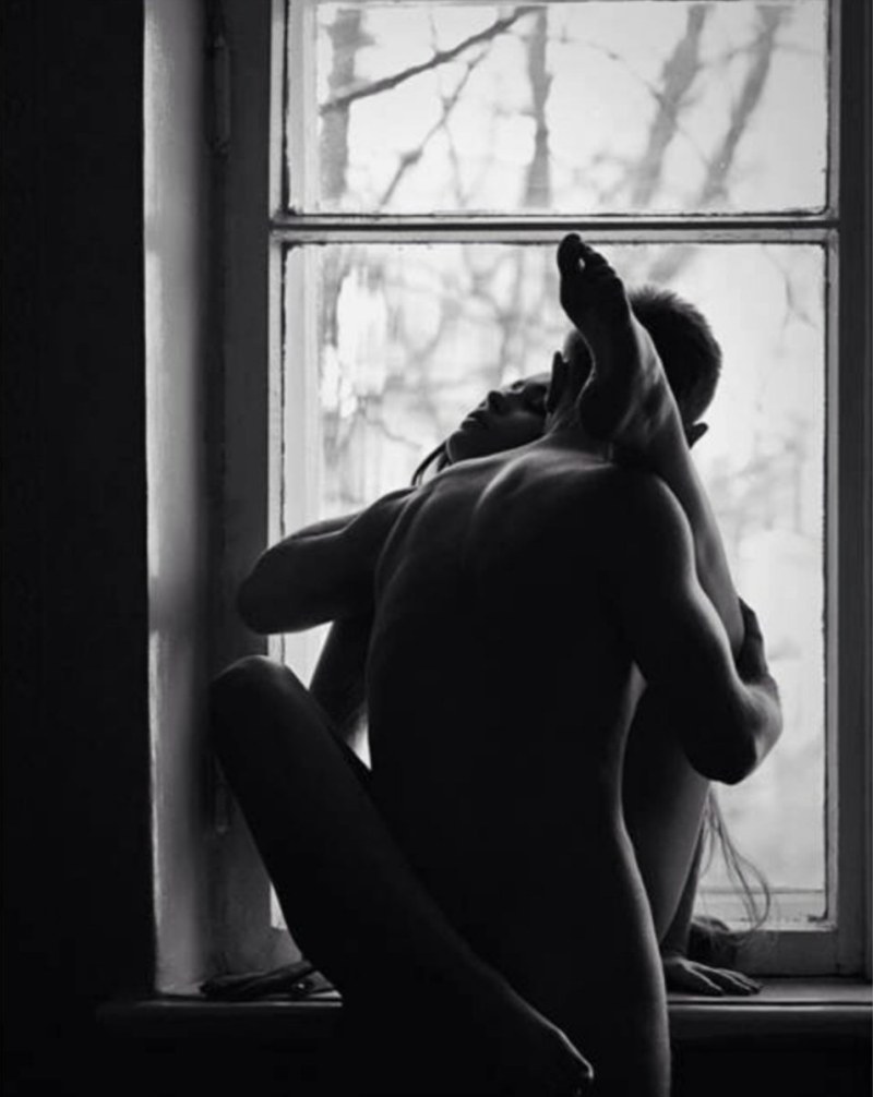 Erotic poses by the window