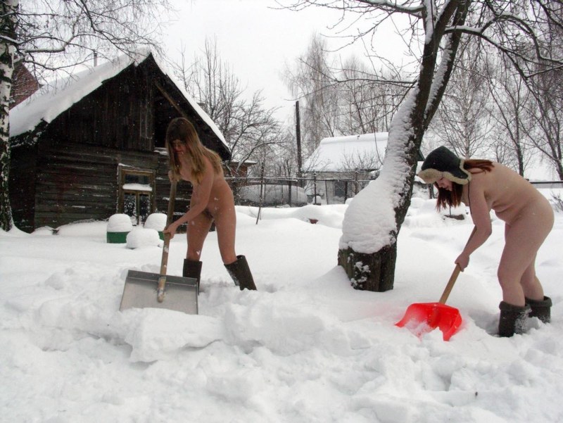 Naked women in the winter in the country