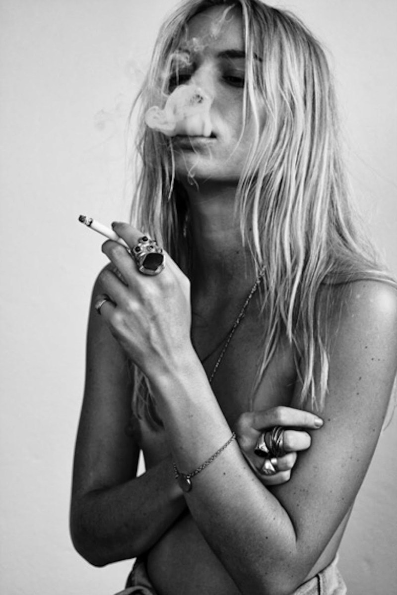 Naked blonde with a cigarette