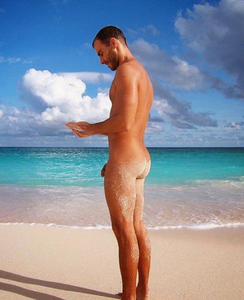 Naked adult man on the beach