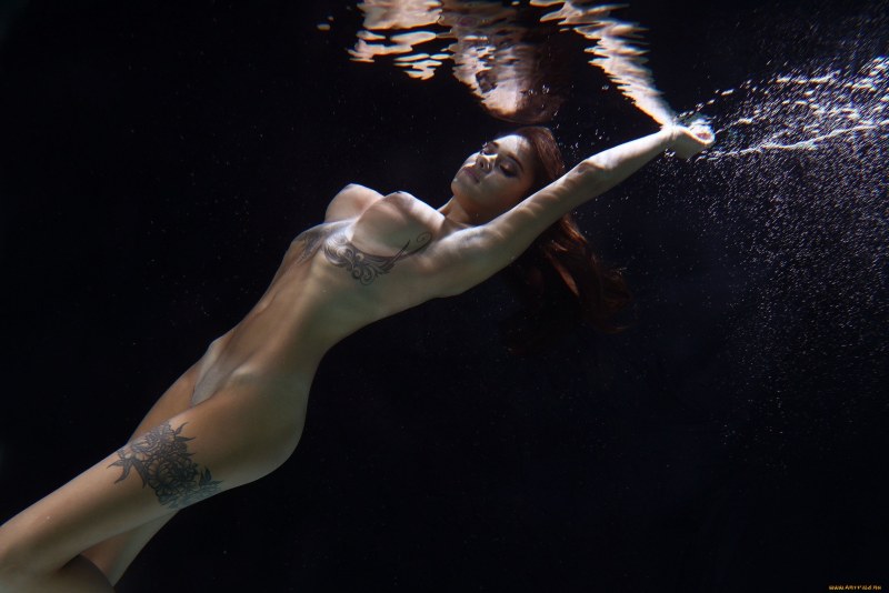 Beautiful naked woman in water