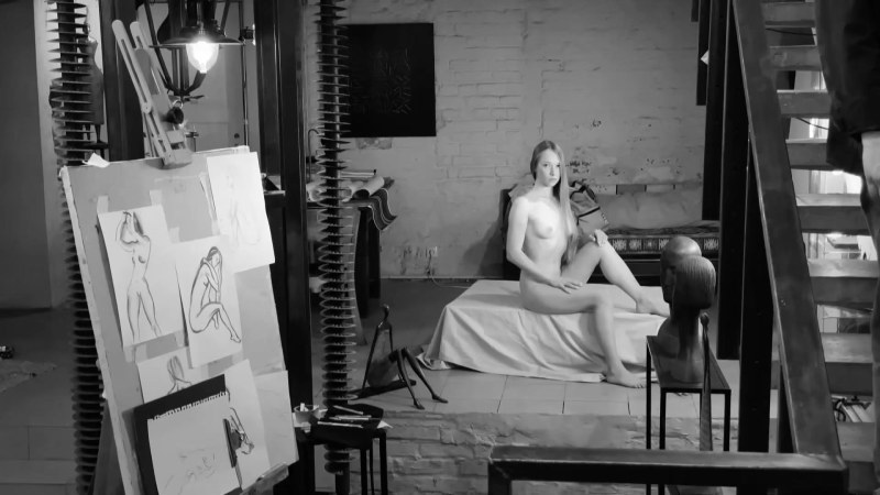 A naked man poses artists