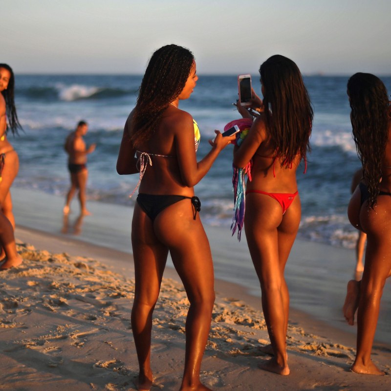 Girls on the beach with a crustacean