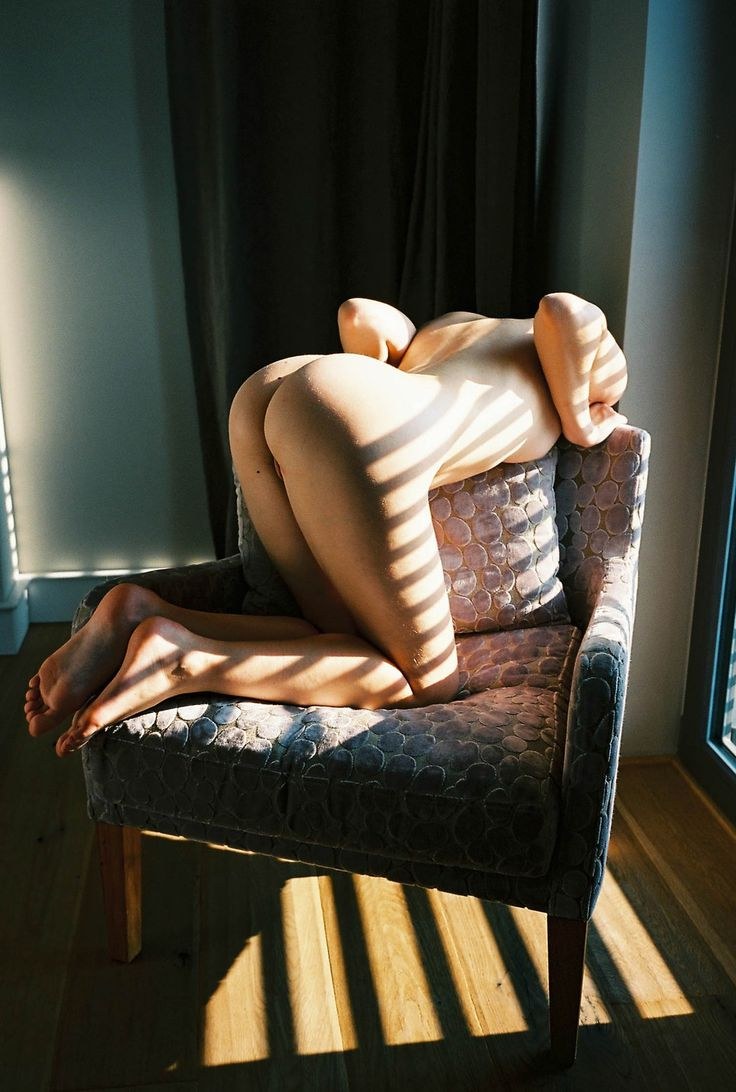 Erotic photo shoot in a chair