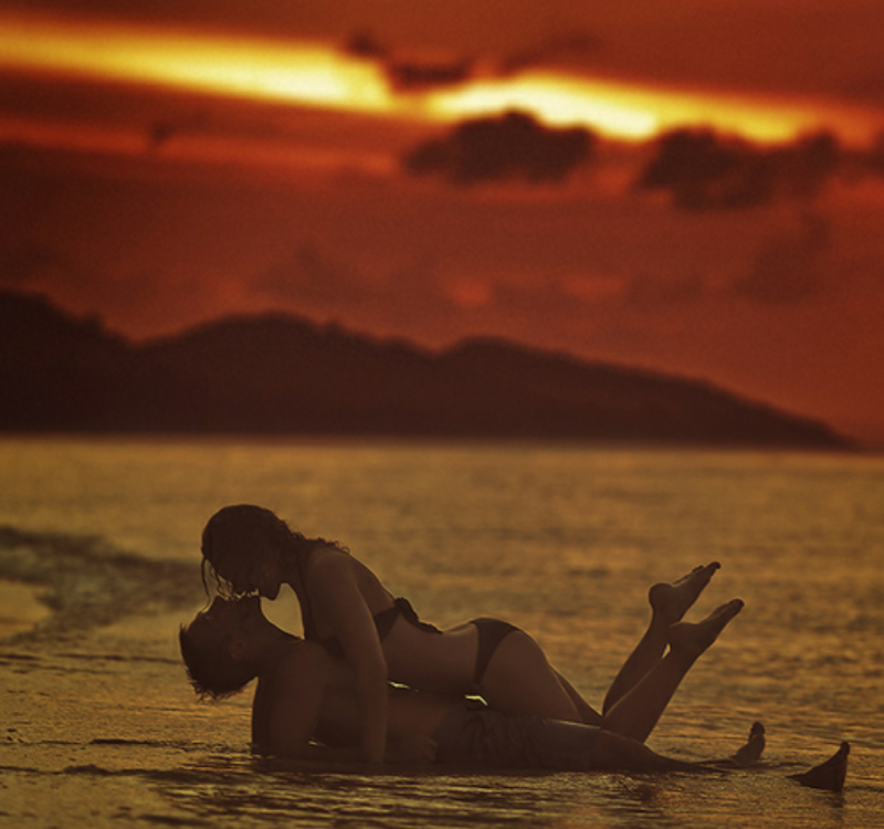 A couple at sea at night