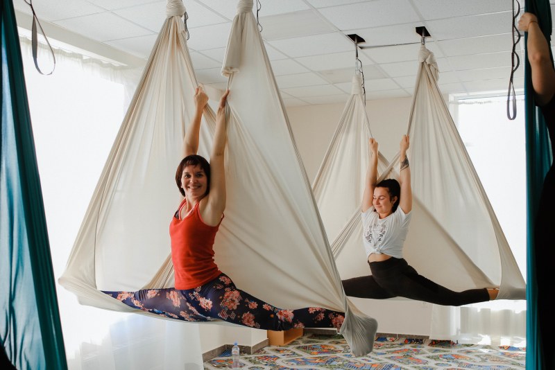 Naked yoga in hammocks