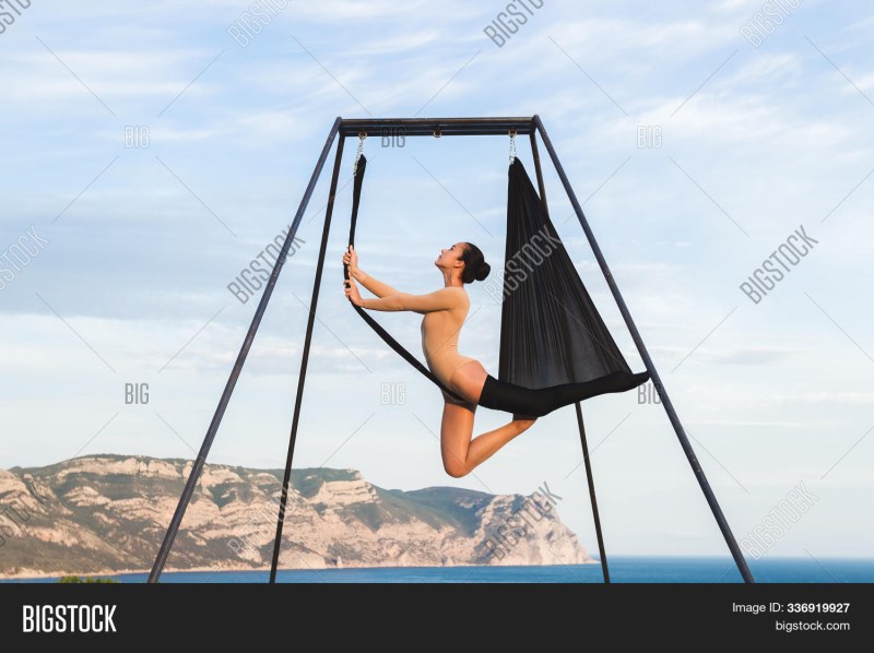 Naked yoga in hammocks