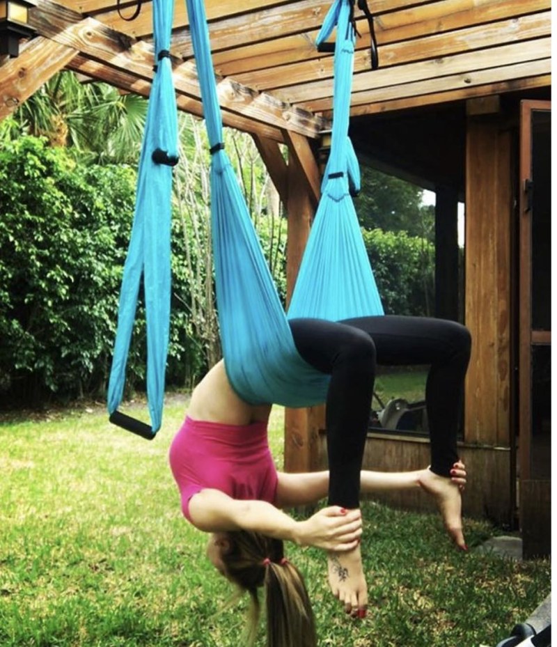 Yoga in hammocks upside down