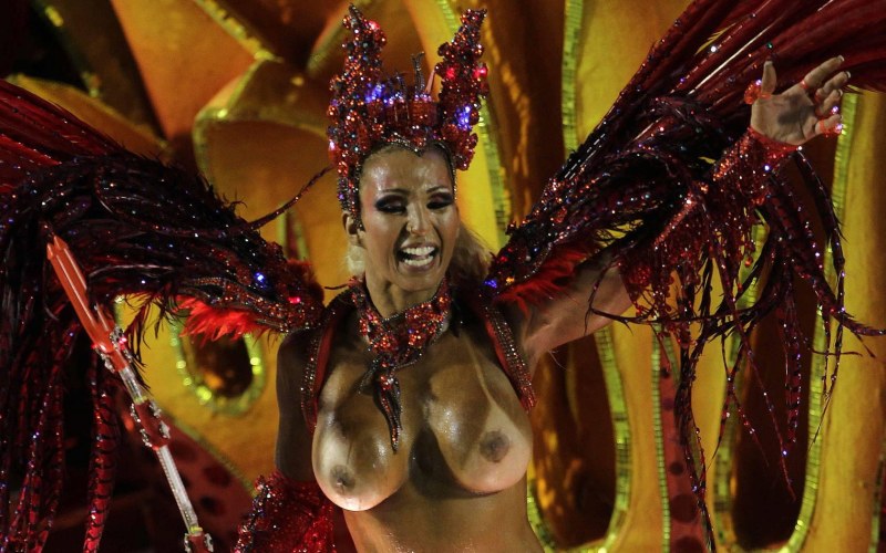 Naked women in carnival costumes