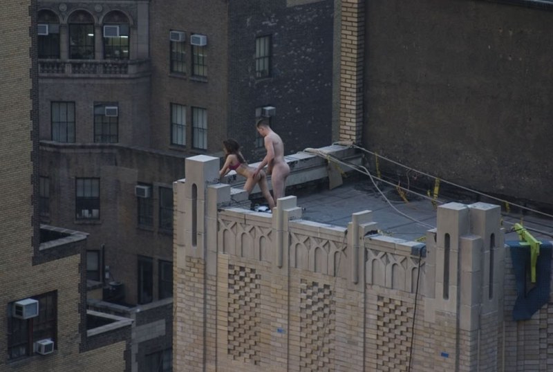 Naked on the roof of a skyscraper