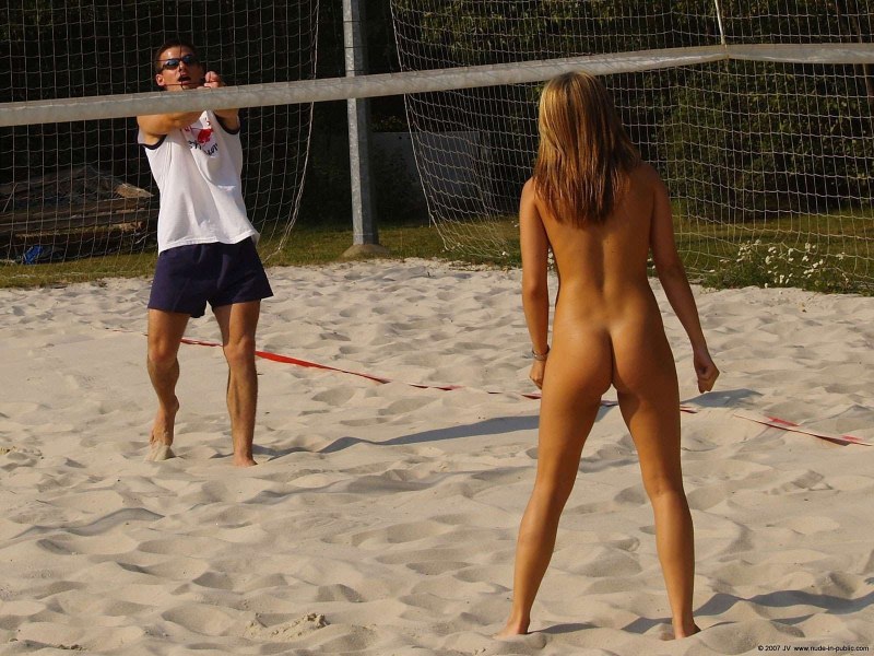 Naked women play volleyball
