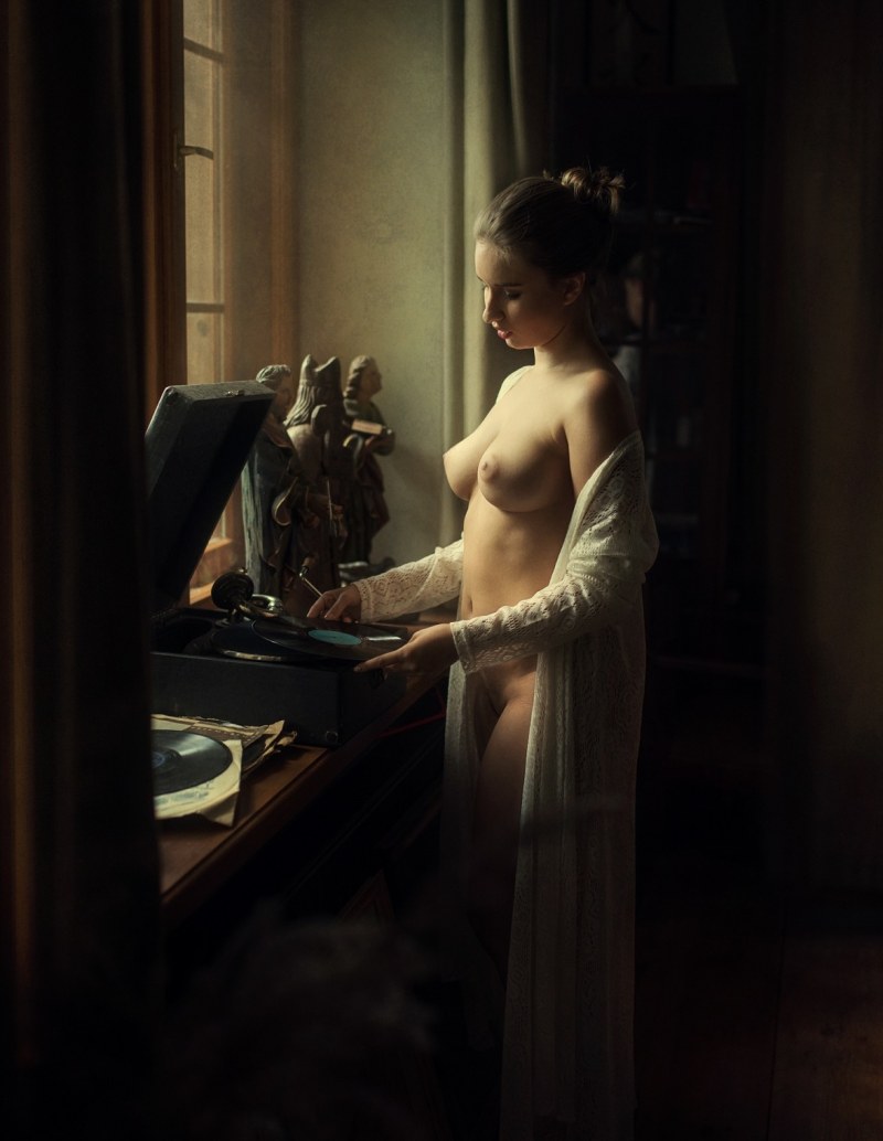 Artistic nude in an armchair