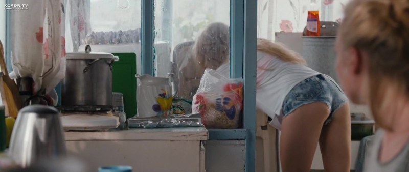 Naked Yana poses at the window