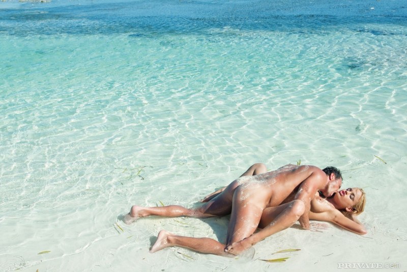Naked man and woman at sea