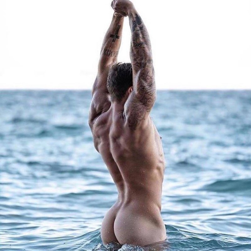 Naked men and women on the beach