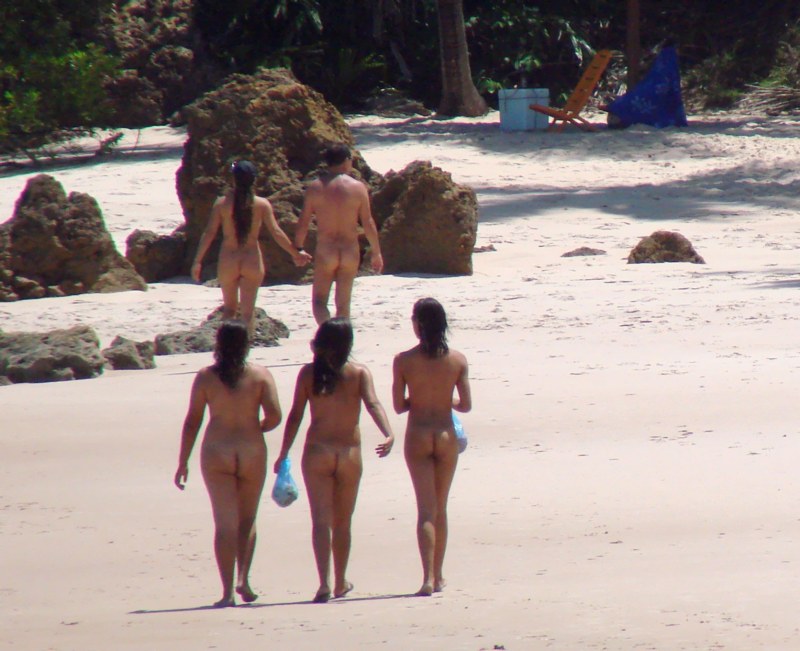 Beginning nudists on the beach