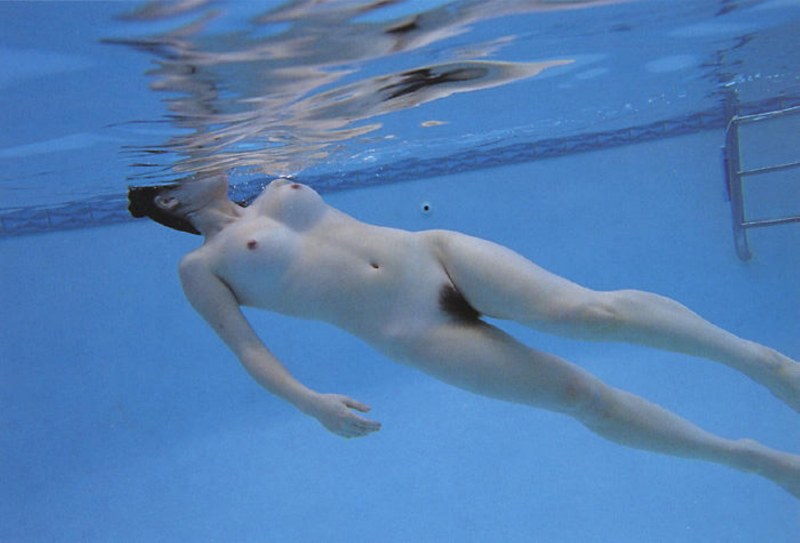 Naked pregnant woman under water