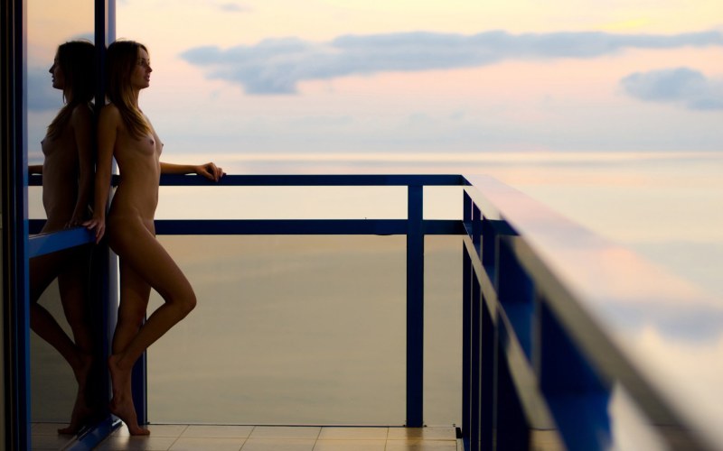 Girl naked on the balcony