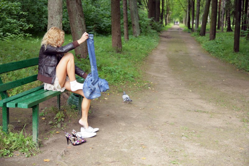 Naked on a bench in the park