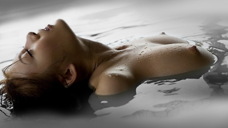 Girl naked at the waterfall