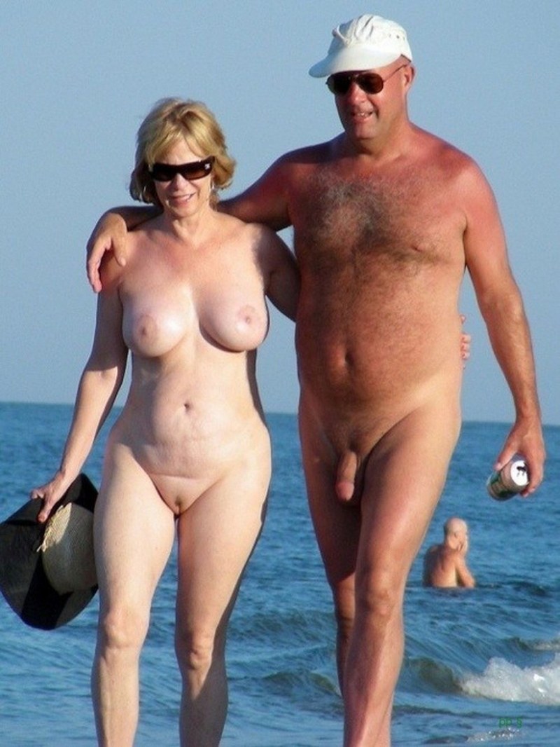 Mature nudists on the beach erection