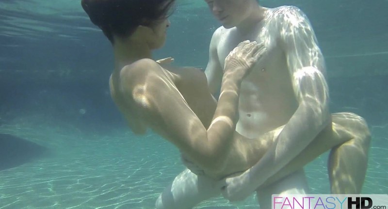 Naked women and guy in water