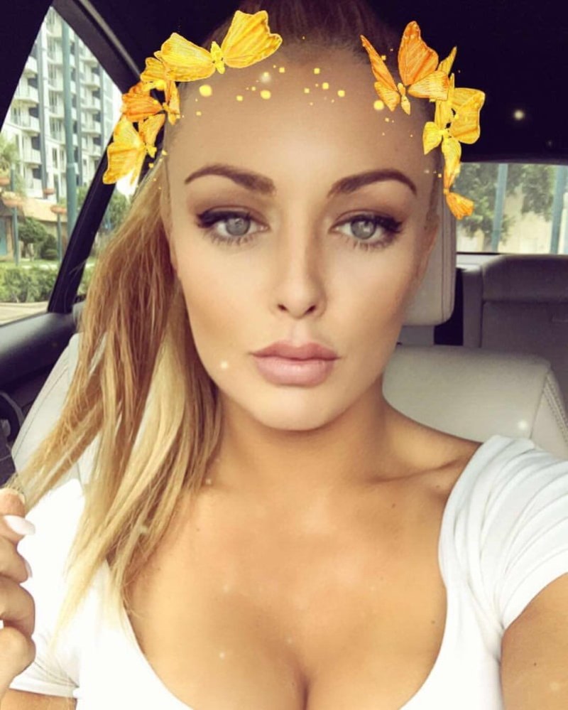 Mendy Rose in a white suit