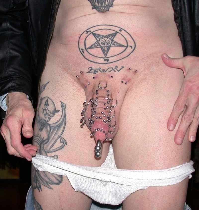 Tattoo member on the pubic girl
