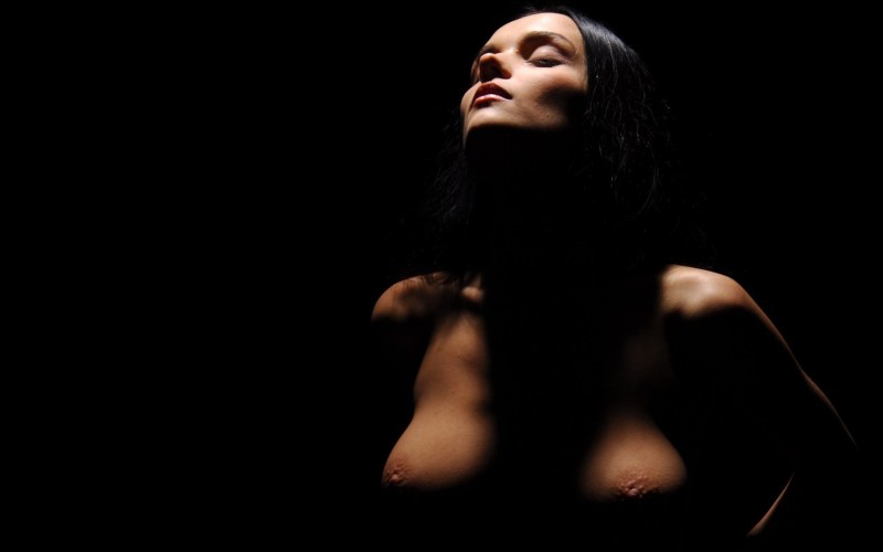 Naked girls dark background