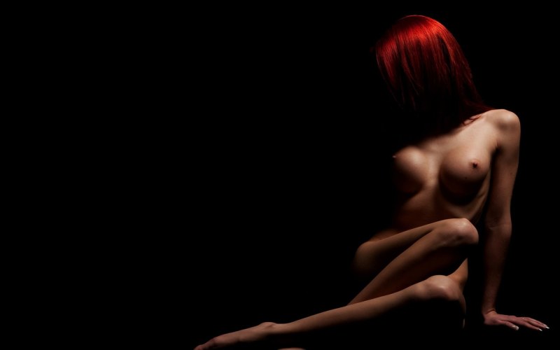 Naked girls dark background