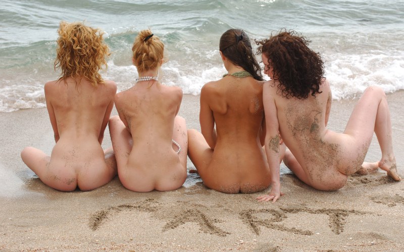 Naked women's butt on the beach
