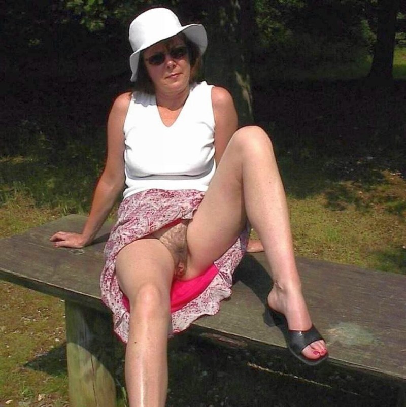 An elderly woman without panties under a skirt