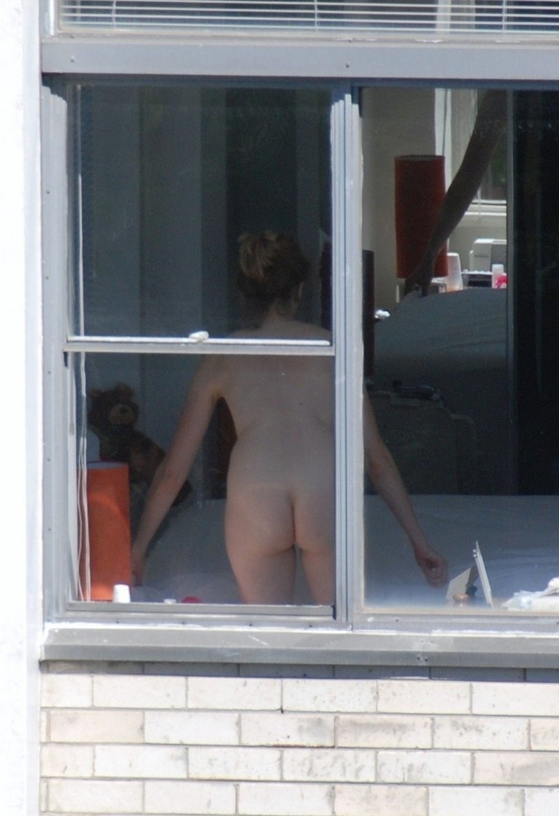 Naked woman in the window opposite