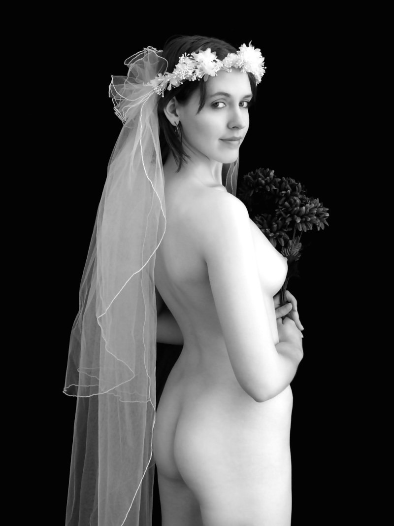 Naked bride in a wedding dress