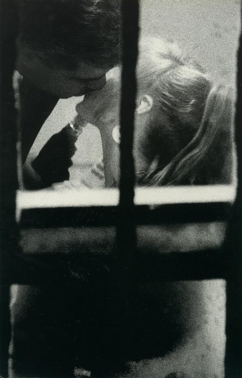 Looks out the window