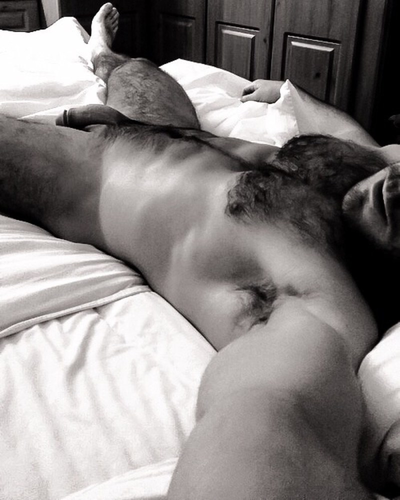 A handsome guy sleeps naked