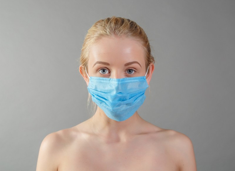 Nude in a medical mask