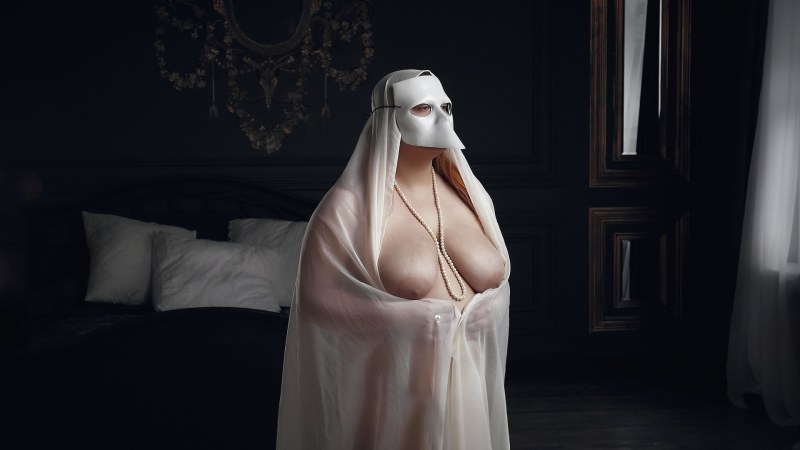 Naked women in masquerade masks