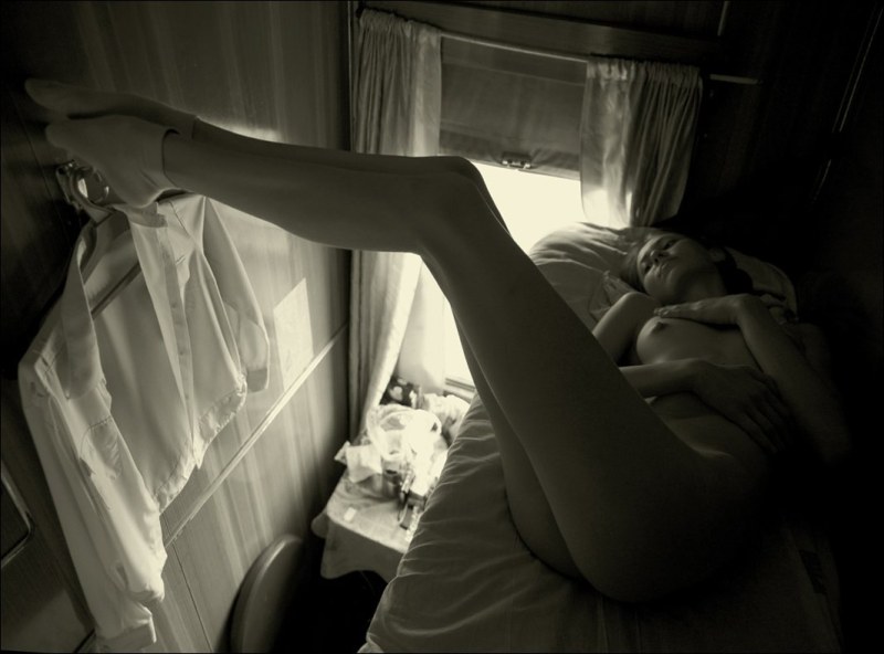 The girl undresses on the train