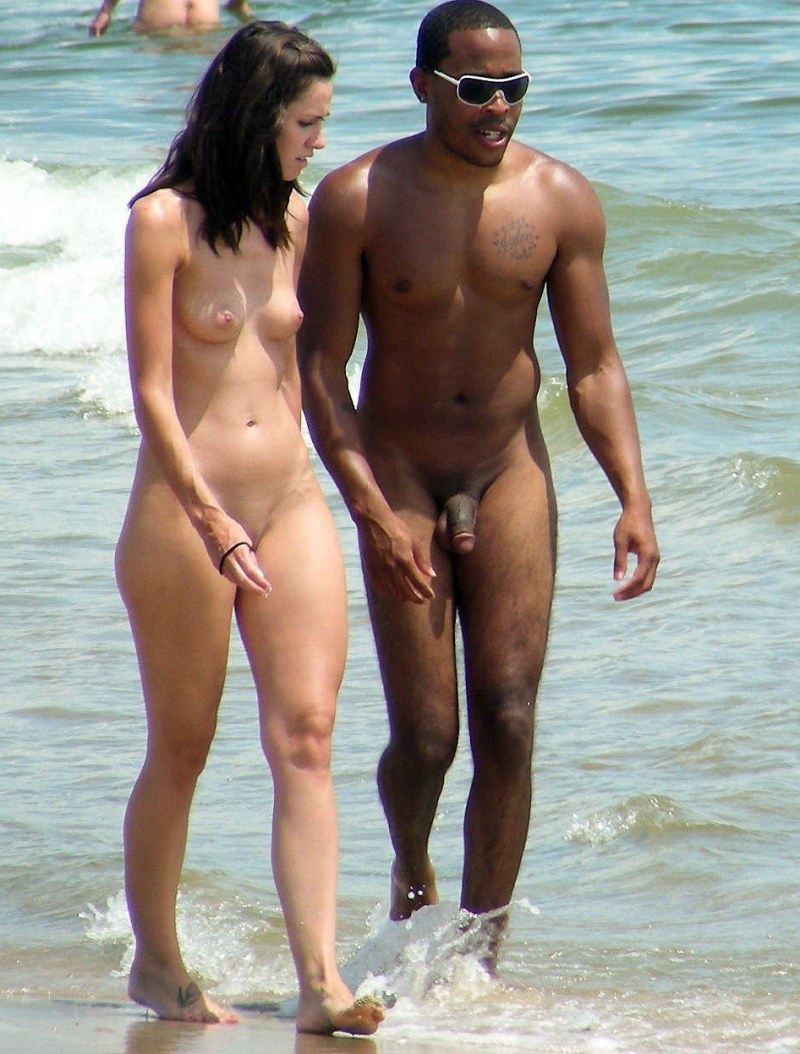 Naked pairs with an erection on the beach