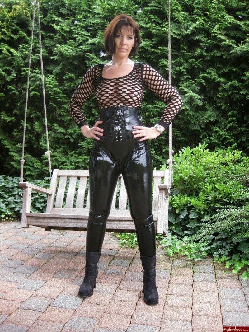 Girl in wet leather leggings